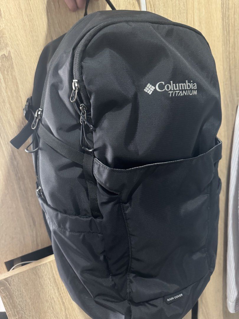 Columbia Titanium Black Backpack with Rain Cover (Category: Backpacks) located in Mandaluyong City. Submitted by raykin (Listing ID 1470392395, Image 1). Description: - Brand: Columbia Titanium - Color: Versatile Black - Comfort: Padded mesh shoulder straps and breathable back panel - Storage: Front slip pocket and multiple secure zipper compartments - Extra Feature: Built-in rain cover located at the bottom - Best For: Hiking, school, and daily 