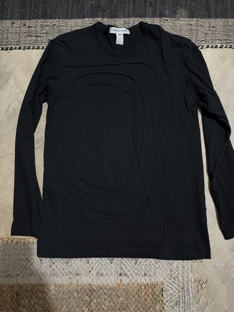 COMME des GARÇONS SHIRT Pull Over (Category: Coats, Jackets and Outerwear) located in Makati City. Submitted by homme.boy.plus (Listing ID 1470480043, Image 1). Description: COMME des GARÇONS SHIRT Black Size Free but can fit S-M 100% Cotton Made in France Unique raw cut unfinished hems and front panel detailing Crew neck .