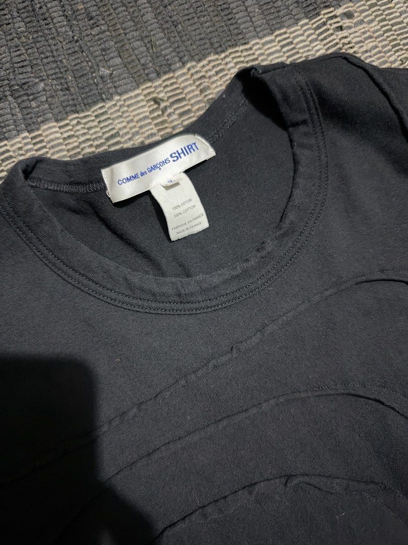 COMME des GARÇONS SHIRT Pull Over (Category: Coats, Jackets and Outerwear) located in Makati City. Submitted by homme.boy.plus (Listing ID 1470480043, Image 2). Description: COMME des GARÇONS SHIRT Black Size Free but can fit S-M 100% Cotton Made in France Unique raw cut unfinished hems and front panel detailing Crew neck .