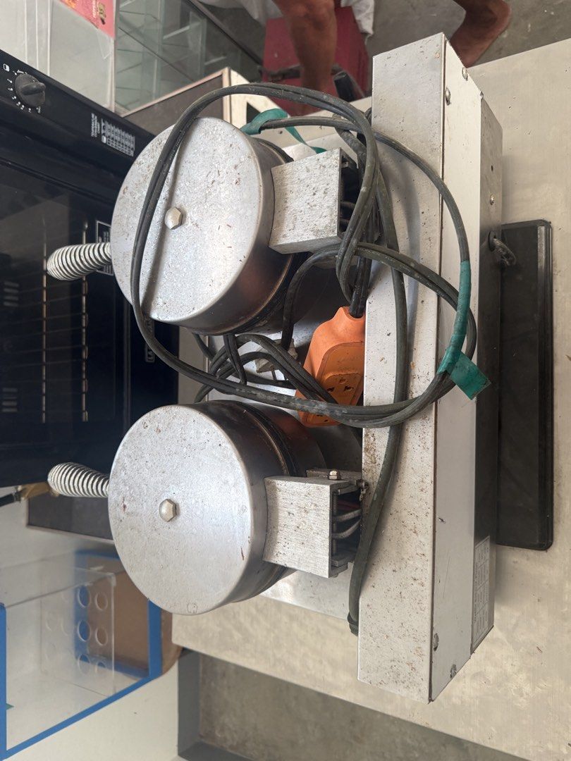 Commercial Waffle Maker 2-Plate SC-X32B (Category: Cookware & Accessories) located in Imus. Submitted by neirasalonga_ (Listing ID 1470441615, Image 1). Description: - Model: SC-X32B Commercial Double Plate Waffle Baker - Power: 2.4KW, 220V (Standard plug attached) - Temperature Range: Adjustable from 50°C to 300°C - Build: Heavy-duty stainless steel with spring-wrapped handles - Condition: Needs a quick wipe down from storage - Ideal Use: Perfec