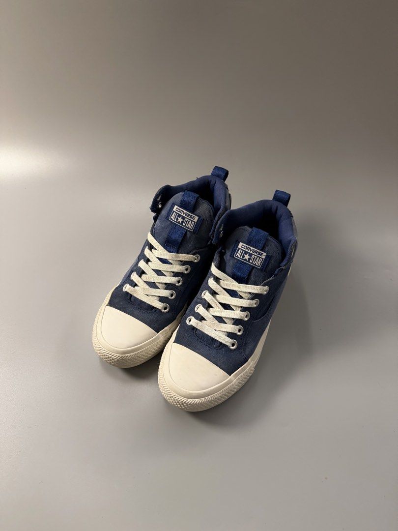 Converse All Star Blue High Top Sneakers Size 7 (Category: Sneakers) located in Quezon City. Submitted by markieexp (Listing ID 1470459782, Image 2). Description: - Brand: Converse All Star - Style: High top sneakers with pull tabs for easy slip-on - Color: Classic navy blue with white rubber toe caps and midsoles - Size: US Men's 7 / Women's 8.5 - Condition: Uppers are clean and intact; soles show only minor dirt from normal wear - Perfect, vers