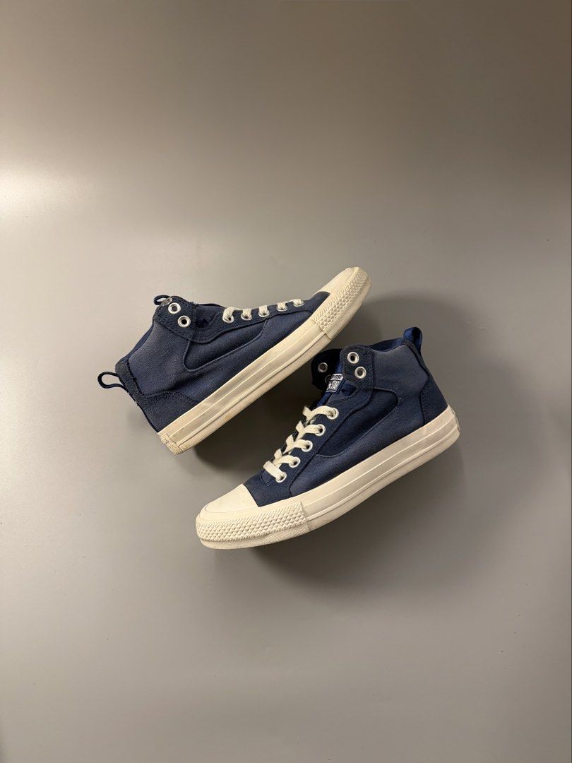 Converse All Star Blue High Top Sneakers Size 7 (Category: Sneakers) located in Quezon City. Submitted by markieexp (Listing ID 1470459782, Image 1). Description: - Brand: Converse All Star - Style: High top sneakers with pull tabs for easy slip-on - Color: Classic navy blue with white rubber toe caps and midsoles - Size: US Men's 7 / Women's 8.5 - Condition: Uppers are clean and intact; soles show only minor dirt from normal wear - Perfect, vers