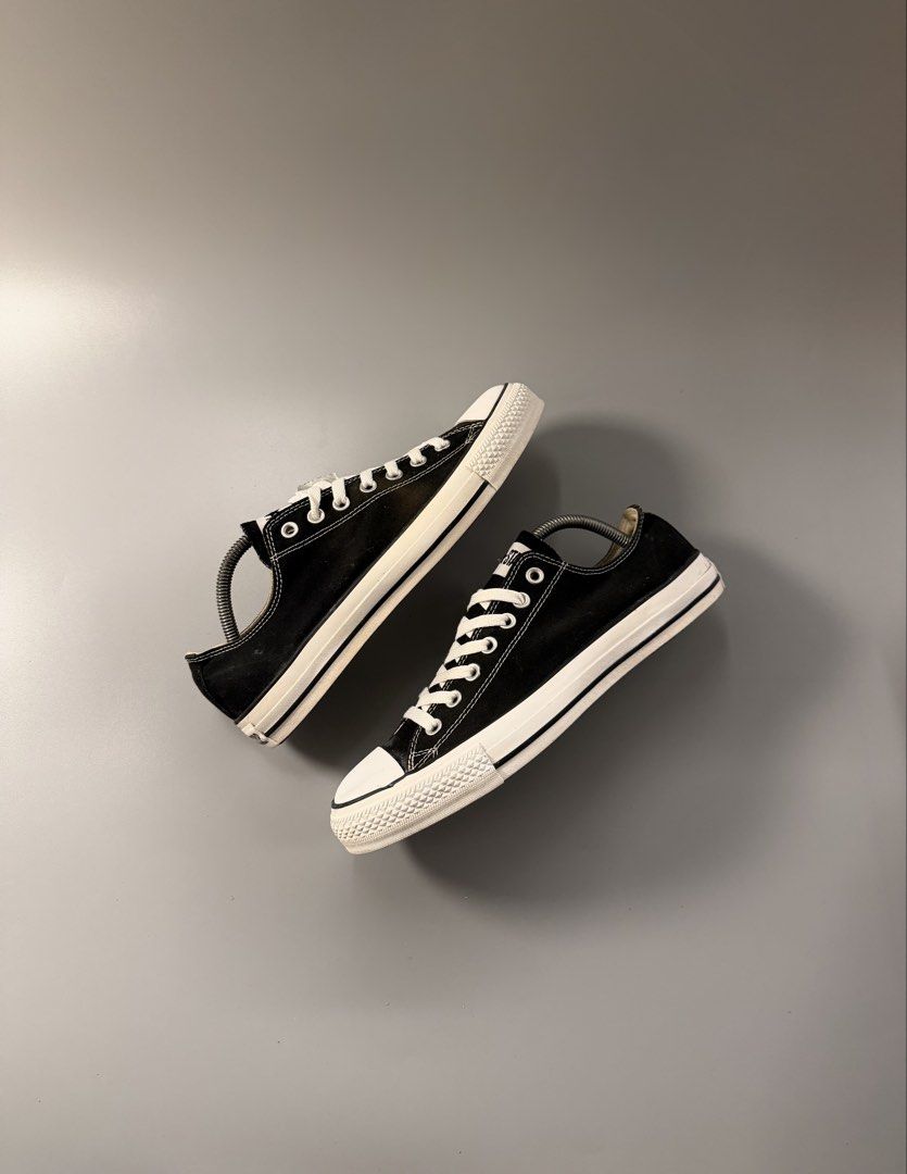 Converse All Star Low Black White 9.5 (Category: Sneakers) located in Quezon City. Submitted by markieexp (Listing ID 1470460519, Image 1). Description: - Brand: Converse All Star - Style: Classic low-top sneakers - Color: Black and White - Size: Men's US 9.5 / Women's US 11.5 / EUR 43 - Material: Canvas upper with rubber toe cap and white laces - Condition: Worn condition with clean outsoles and legible interior tag - Perfect for everyday casual