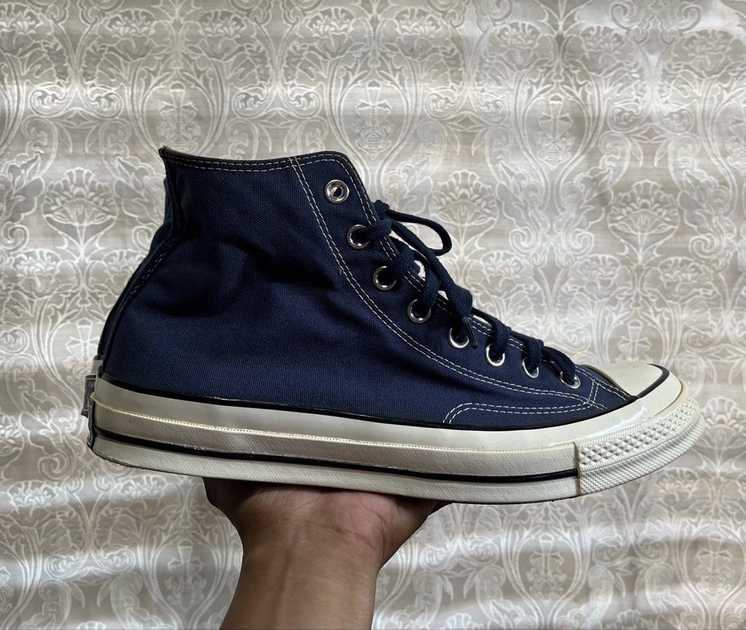Converse Chuck 70 High Top Navy Blue (Category: Shoe inserts & accessories) located in General Santos City (Dadiangas). Submitted by thiftnibadi3 (Listing ID 1470395132, Image 3). Description: - Brand: Converse Chuck 70 High Top - Color: Navy blue with dark blue laces - Material: Premium canvas upper with contrast stitching - Design Details: Classic rubber toe cap, vulcanized sole, black foxing stripe on midsole - Branding: Iconic black and white