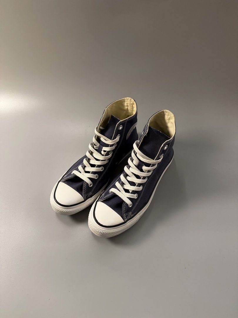 Converse Chuck Taylor All Star High Top Navy Blue (Category: Sneakers) located in Quezon City. Submitted by markieexp (Listing ID 1470459780, Image 2). Description: - Brand/Model: Converse High Tops - Color: Classic Navy Blue - Size: Men's 7.5 / Women's 9.5 / EUR 41 - Condition: Very clean overall with minimal sole wear - Details: Canvas upper, white laces, and rubber toe caps - Style: Versatile everyday sneakers that match any outfit.