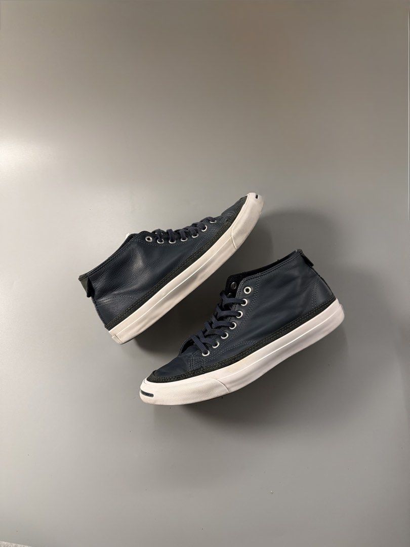 Converse Jack Purcell Leather Mid Navy (Category: Sneakers) located in Quezon City. Submitted by markieexp (Listing ID 1470460025, Image 1). Description: - Brand/Model: Converse Jack Purcell Mid-Top Sneakers - Color: Dark blue leather with white midsoles and brown traction outsoles - Size: Men's 8.5 US / 42 EUR - Features: Signature toe cap and smile detail, lace-up front, premium leather upper - Condition: Clean overall condition with only light
