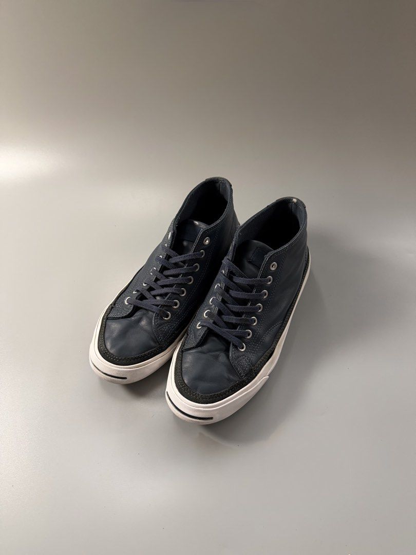 Converse Jack Purcell Mid Leather Navy Blue Size 8.5 US (Category: Sneakers) located in Caloocan City. Submitted by maempenafi21452 (Listing ID 1470461240, Image 2). Description: - Brand/Model: Converse Jack Purcell Mid-Top - Color: Dark Navy Blue - Material: Leather upper with white rubber midsole and brown outsole - Size: Men's US 8.5 - Condition: Gently used, minimal creasing on leather, light dirt on soles from normal walking - Details: Class