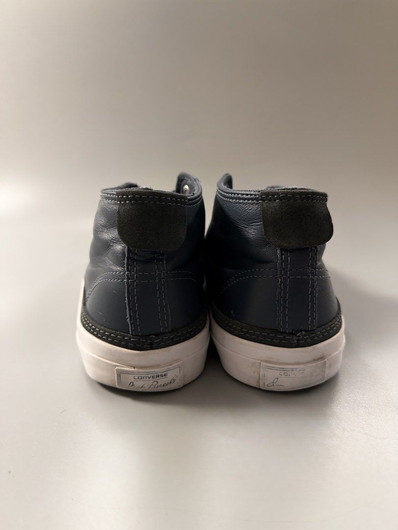 Converse Jack Purcell Mid Leather Navy Blue Size 8.5 US (Category: Sneakers) located in Caloocan City. Submitted by maempenafi21452 (Listing ID 1470461240, Image 3). Description: - Brand/Model: Converse Jack Purcell Mid-Top - Color: Dark Navy Blue - Material: Leather upper with white rubber midsole and brown outsole - Size: Men's US 8.5 - Condition: Gently used, minimal creasing on leather, light dirt on soles from normal walking - Details: Class