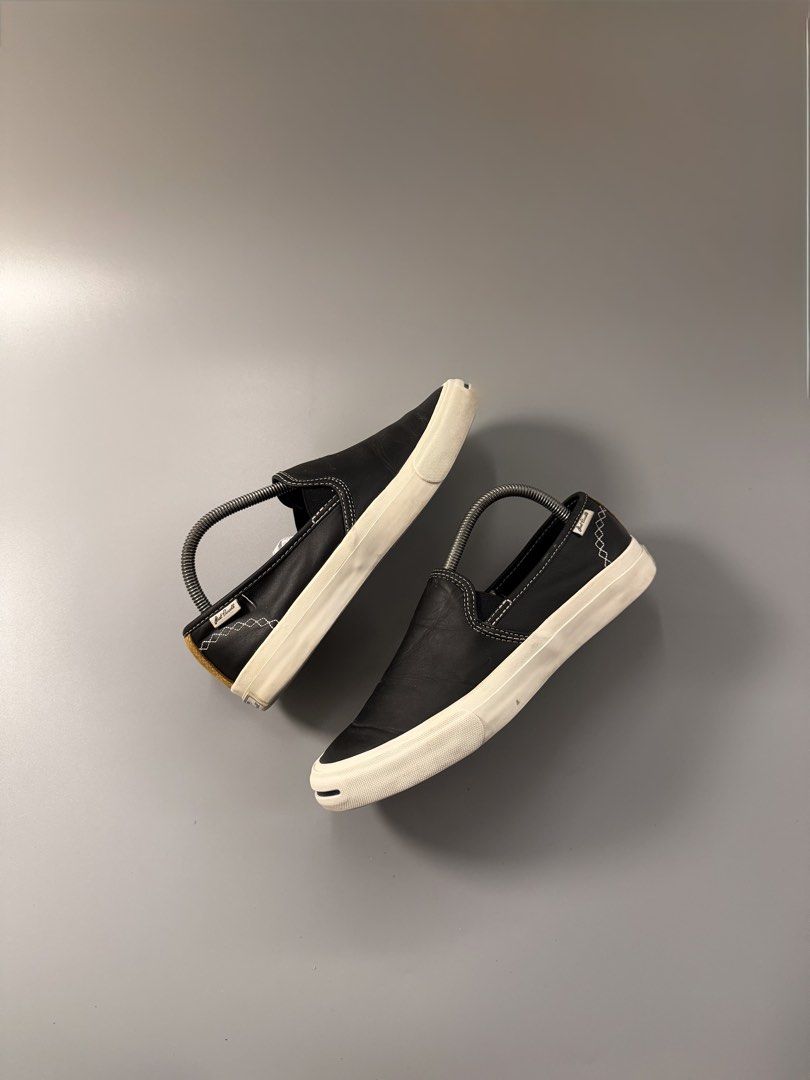 Converse Jack Purcell Slip-On Black Leather (Category: Sneakers) located in Caloocan City. Submitted by maempenafi21452 (Listing ID 1470461738, Image 1). Description: - Brand: Converse Jack Purcell - Style: Slip-on sneakers in black leather - Details: White contrast stitching, diamond pattern sides, brown suede heel panel, and classic toe smile - Soles: Rubber outsoles with minimal wear - Fit: Easy to slip on and off for everyday casual wear.