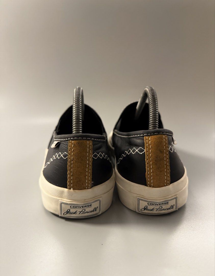 Converse Jack Purcell Slip-On Black Leather (Category: Sneakers) located in Caloocan City. Submitted by maempenafi21452 (Listing ID 1470461738, Image 3). Description: - Brand: Converse Jack Purcell - Style: Slip-on sneakers in black leather - Details: White contrast stitching, diamond pattern sides, brown suede heel panel, and classic toe smile - Soles: Rubber outsoles with minimal wear - Fit: Easy to slip on and off for everyday casual wear.