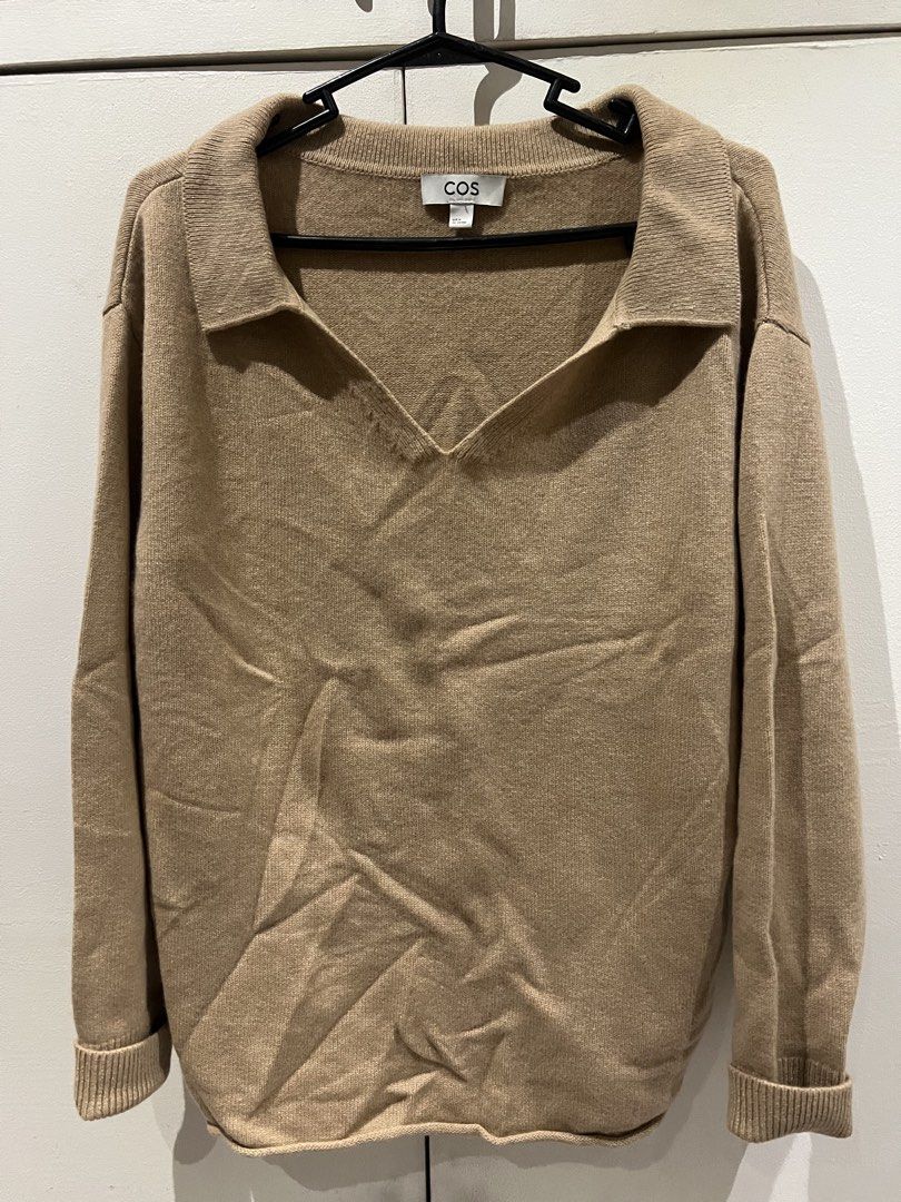COS Collared V-Neck Knit Sweater Camel Size M (Category: Coats, Jackets and Outerwear) located in Quezon City. Submitted by Zandee (Listing ID 1470487356, Image 1). Description: - Brand/Model: COS knit sweater - Color: Camel brown - Size: EUR M - Design: V-neckline with a pointed collar - Fit: Relaxed fit with long sleeves and ribbed cuffs - Material: Soft knit, ideal for layering during cooler weather - Condition: Excellent.