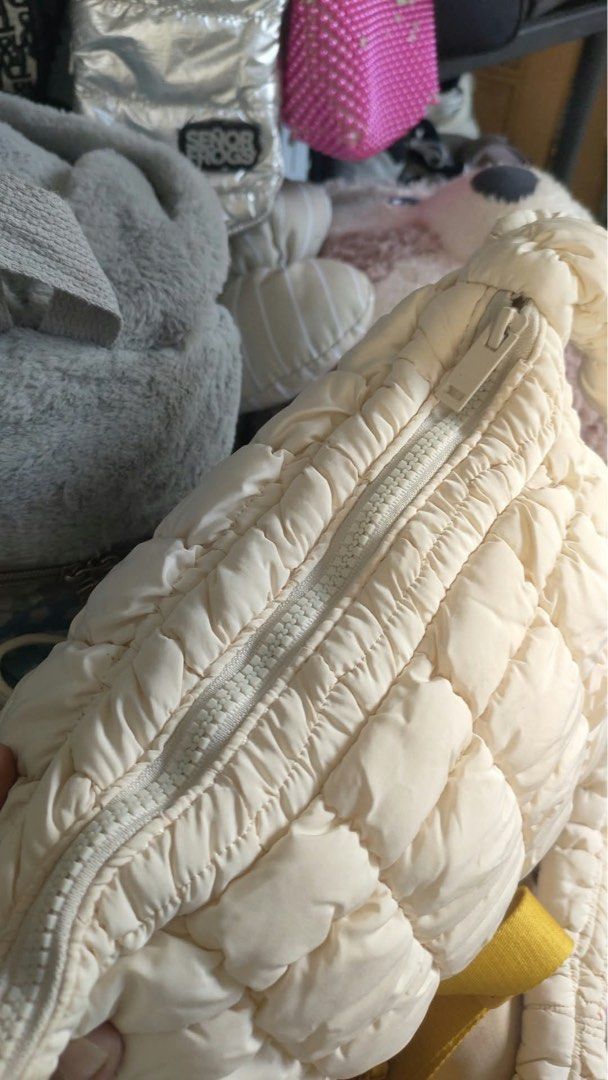 COS Quilted Cloud Mini Shoulder Bag Off White (Category: Shoulder Bags) located in Carmen. Submitted by rr_thrifts (Listing ID 1470397437, Image 2). Description: - Brand: COS - Style: Puffer quilted shoulder bag with matching handles - Material: 100% lightweight synthetic - Closure: Zip top with inner zip pocket and brand label tag - Capacity: Spacious for daily essentials .