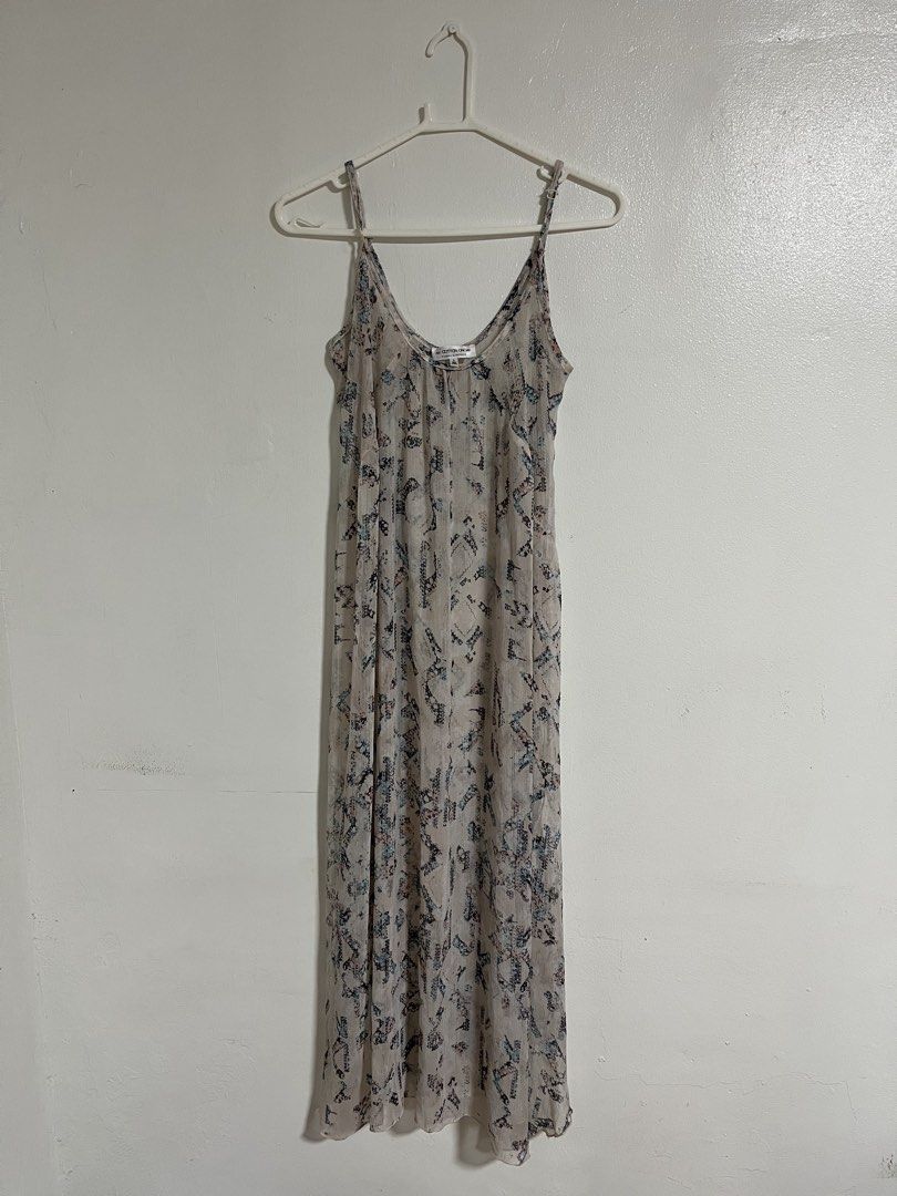 Cotton On Printed Spaghetti Strap Maxi Dress (Category: Dresses) located in Cabuyao City. Submitted by rdtrmt (Listing ID 1470450562, Image 1). Description: - Brand: Cotton On - Size: Small - Style: Relaxed fit maxi dress with a flowy silhouette and pullover style - Straps: Adjustable spaghetti straps - Fabric: Lightweight, sheer material - Design: All-over abstract geometric print in black, blue, and pink on a neutral off-white background - Cond