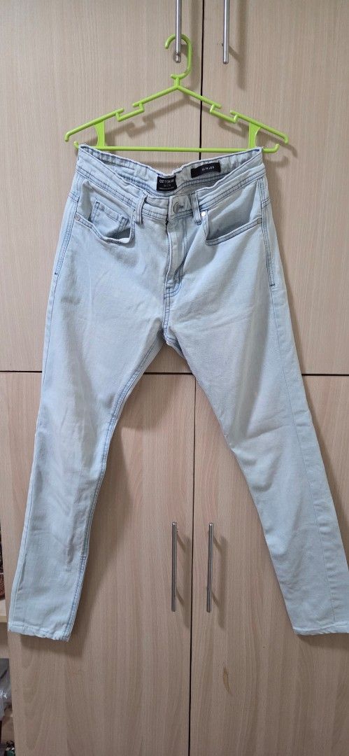 Cotton On Slim Leg Light Blue Jeans (Category: Jeans) located in Manila. Submitted by doyak (Listing ID 1470419436, Image 1). Description: - Brand: Cotton On - Color: Light wash blue - Fit: Slim fit, mid-rise waist - Features: Standard belt loops, front pockets, classic zip fly with button closure - Style: Casual everyday denim pants - Condition: Well-maintained.