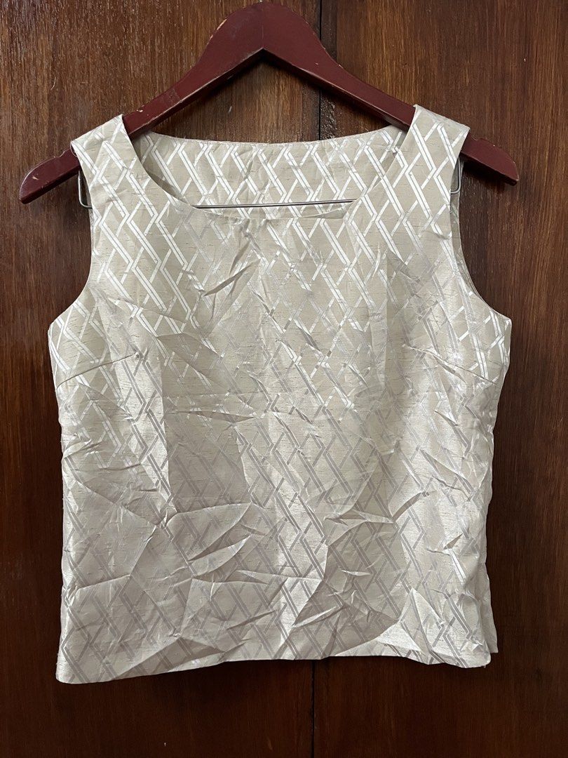 Cream and Silver Geometric Sleeveless Top (Category: Sleeveless) located in Caloocan City. Submitted by dubaichewycooki (Listing ID 1470386132, Image 1). Description: - Color: Cream with silver geometric diamond pattern - Style: Sleeveless with a classic scoop neckline - Fabric: Textured weave with a straight hem - Detail: Clean back featuring a center seam - Versatility: Perfect for both casual wear and dressing up.