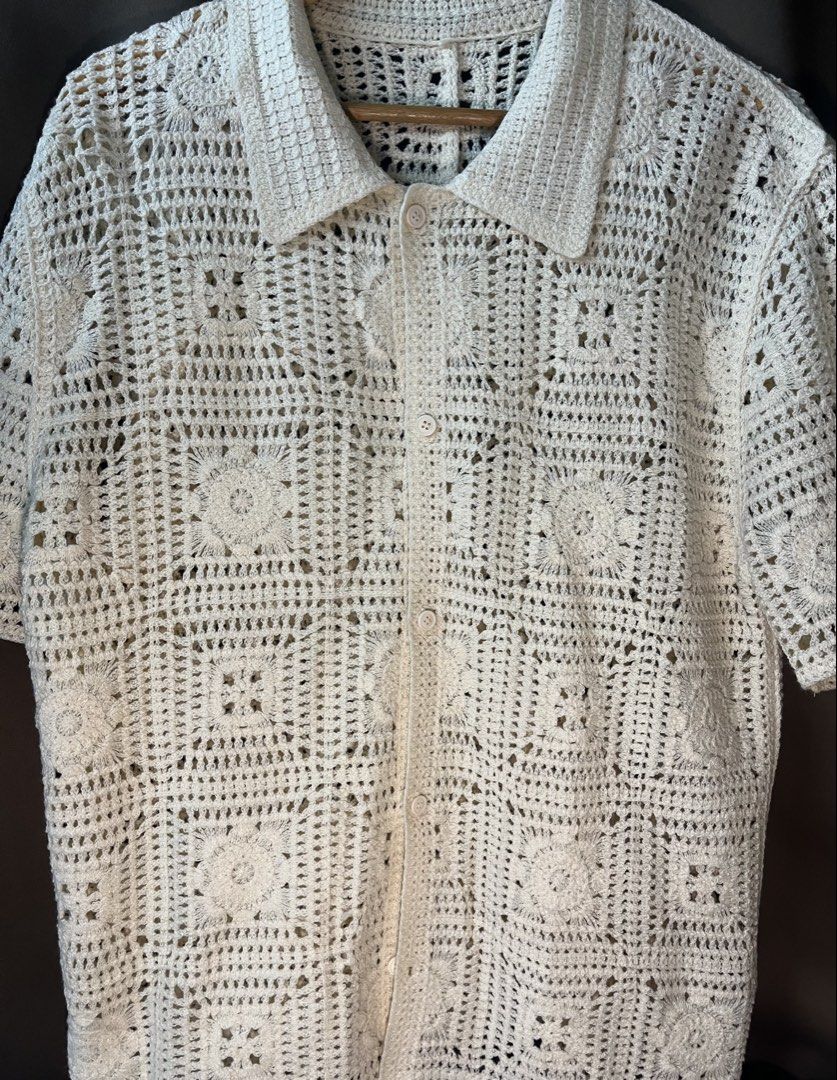 Cream Crochet Polo (Shein) (Category: Tshirts & Polo Shirts ) located in Manila. Submitted by rrr.decoolter.888 (Listing ID 1470522841, Image 3). Description: - Style: Cream crochet knit short sleeve shirt with classic collar and front buttons - Size: 27x20 - Design: All-over open weave floral square pattern - Condition: 10/10 super nice in person! .