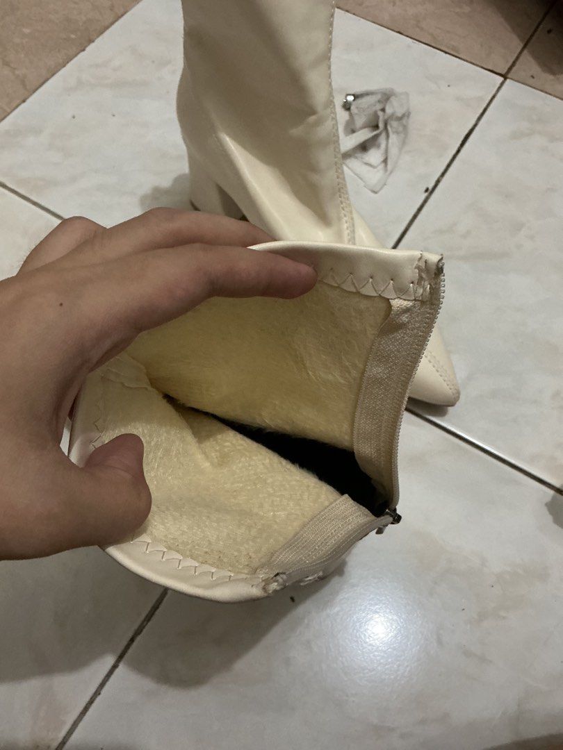 Cream pointed toe block heel booties size 36 (Category: Boots) located in Quezon City. Submitted by jessagggg (Listing ID 1470438978, Image 3). Description: - Style: Cream ankle boots with pointed toes and chunky block heels - Material: Faux leather outer with a cozy furry lining for cooler weather - Size: 36 (stamped on outsole) - Closure: Back zipper for easy wear - Condition: Excellent, clean soles with hardly any wear.