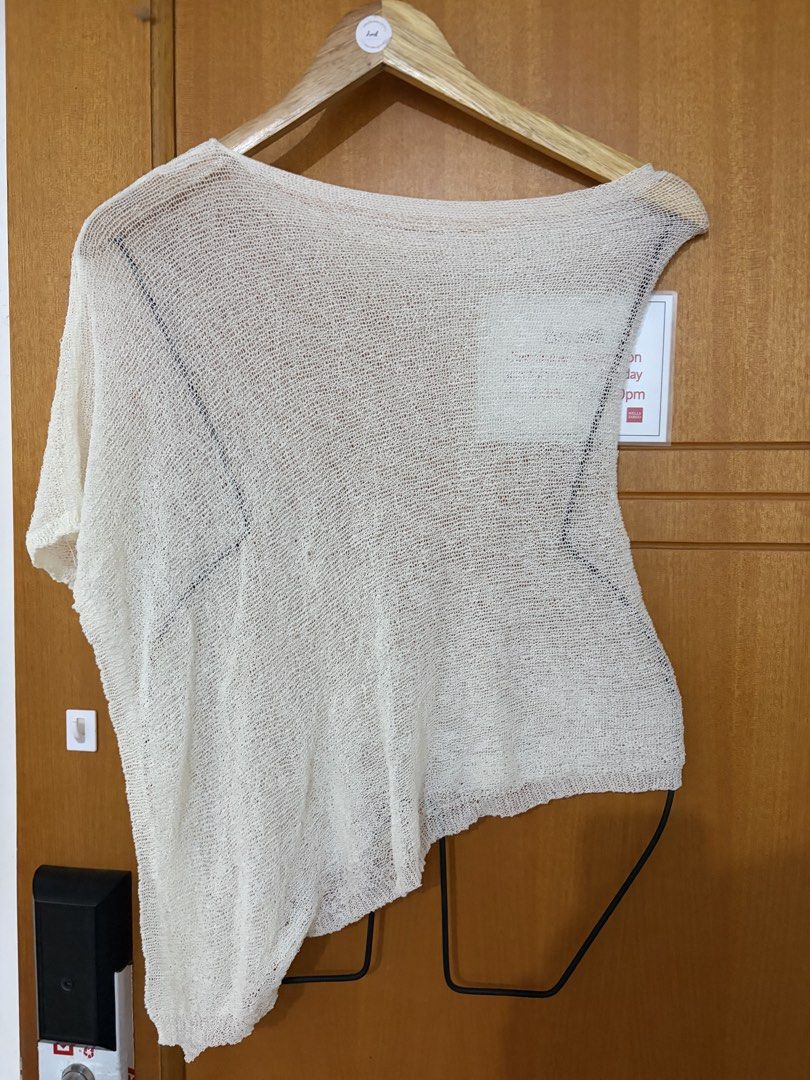 Cream PonchoTop Plus size/ Cover up (Category: Sleeveless) located in Taguig. Submitted by preloved_by_janel (Listing ID 1470507846, Image 1). Description: - Color: Cream/dirty white - Style: Asymmetrical hem, wide neckline, relaxed oversized fit - Material: Lightweight, open weave knit fabric - Versatility: Great for layering over basic tanks or swimwear - Fit Note: Drapes beautifully when worn (looks crooked only on the hanger).