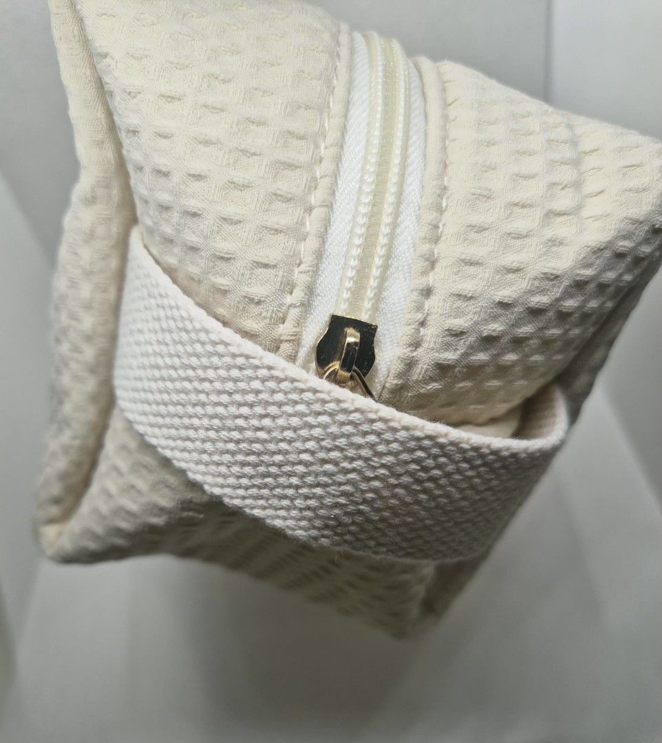 Cream Waffle Cosmetic Pouch with Envelope Embroidery (Category: Purses & Pouches) located in Manila. Submitted by prelovedbyc.hannah (Listing ID 1470358678, Image 3). Description: - Free pouch upon purchase of any Dior cosmetic set - Color & Material: Cream-coloured waffle fabric - Design: Cute embroidered love letter envelope with a tiny red heart - Interior: Fully lined in white fabric with built-in slip pockets - Hardware: Sturdy white zipper 