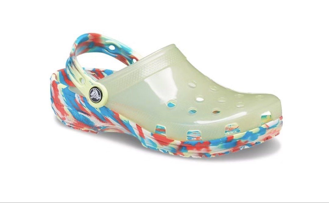 Crocs Classic Translucent Marble Clog m3W5 (Category: Slippers and slides) located in Laoag. Submitted by maepril (Listing ID 1470519961, Image 1). Description: - Style: Translucent upper with colorful red, blue, and yellow marbled sole - Comfort: Lightweight foam construction with ventilation ports for breathability - Fit: Signature pivoting heel strap with Crocs button logo - Design: Easy slip-on style featuring a matching marbled footbed - Con