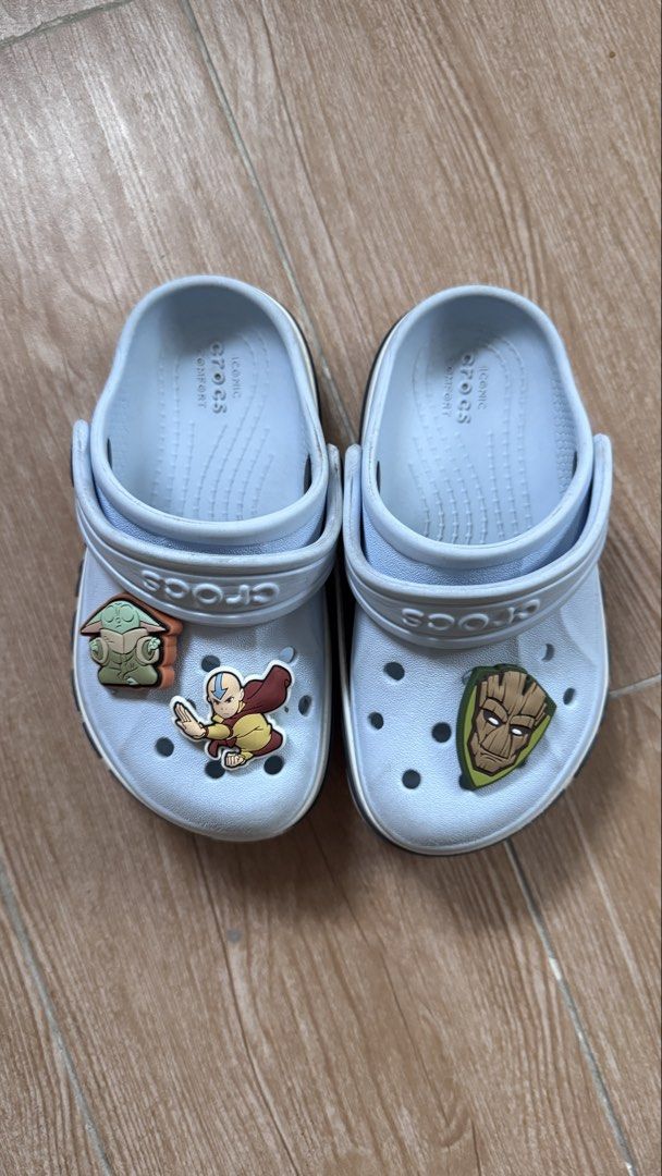Crocs Size C8 Light Blue Bayaband Clog with Charms (Category: Babies & Kids Fashion) located in Cainta. Submitted by littlemissvietnam (Listing ID 1470442427, Image 3). Description: - Color: Light blue with black side branding - Style: Platform sole, slip-on with pivoting heel strap - Condition: Clean with minimal wear - Inclusions: 3 character charms (Groot, Baby Yoda, and Aang) - Comfort: Iconic Crocs comfort footbed.