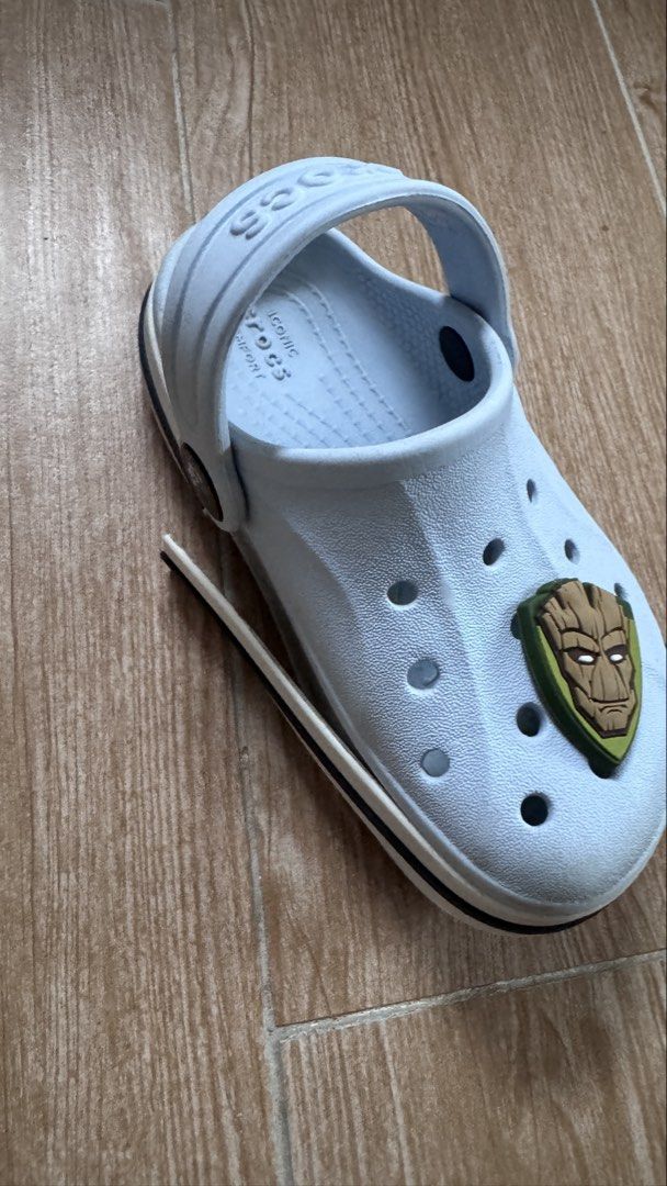 Crocs Size C8 Light Blue Bayaband Clog with Charms (Category: Babies & Kids Fashion) located in Cainta. Submitted by littlemissvietnam (Listing ID 1470442427, Image 2). Description: - Color: Light blue with black side branding - Style: Platform sole, slip-on with pivoting heel strap - Condition: Clean with minimal wear - Inclusions: 3 character charms (Groot, Baby Yoda, and Aang) - Comfort: Iconic Crocs comfort footbed.