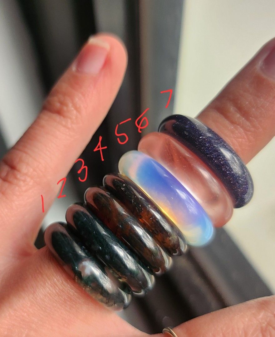 (Bundle Price Available!!!) Crystal Bangle Rings US Sizes 5.5, 6.5, & 7 (Category: Rings) located in Baguio. Submitted by lausgem2026 (Listing ID 1470424570, Image 2). Description: Crystal Bangle Rings: 1 - Dark Green Moss Agate (Natural) 2 - Green Moss Agate (Natural) 3 - Red Moss Agate (Natural) 4 - Orange Moss Agate (Natural) 5 - Opalite (Man-made) 6 - Watermelon (Man-made) 7 - Blue Sandstone (Man-made) Sizes: 1 - US 5.5/16.1mm 2 - US 6.5/17mm