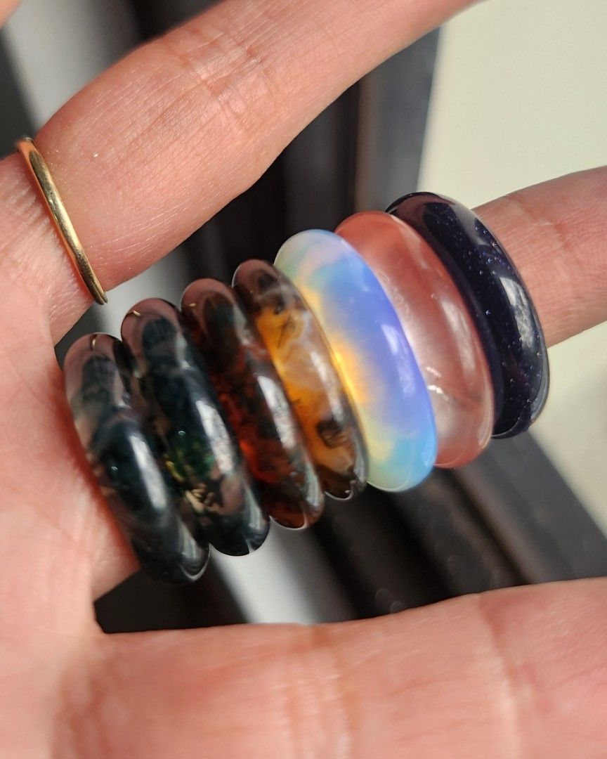 (Bundle Price Available!!!) Crystal Bangle Rings US Sizes 5.5, 6.5, & 7 (Category: Rings) located in Baguio. Submitted by lausgem2026 (Listing ID 1470424570, Image 3). Description: Crystal Bangle Rings: 1 - Dark Green Moss Agate (Natural) 2 - Green Moss Agate (Natural) 3 - Red Moss Agate (Natural) 4 - Orange Moss Agate (Natural) 5 - Opalite (Man-made) 6 - Watermelon (Man-made) 7 - Blue Sandstone (Man-made) Sizes: 1 - US 5.5/16.1mm 2 - US 6.5/17mm