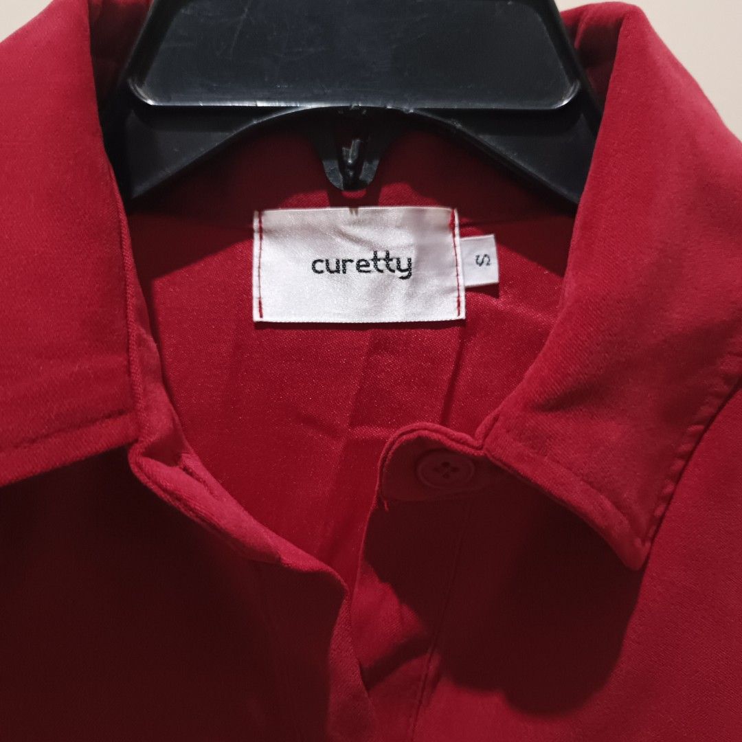 Curetty Red Button-Up Jacket Size S (Category: Coats, Jackets and Outerwear) located in Davao. Submitted by jjj_mncd (Listing ID 1470528001, Image 2). Description: - Brand: Curetty - Size: S - Color: Maroon - Style Number: AC164ST003 - Material: 97% polyester, 3% polyurethane (lightweight) - Features: Collared neck, front button-up, long sleeves with elastic cuffs, elastic hem - Condition: Great for casual everyday styling.