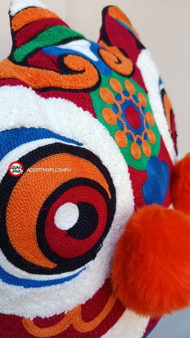 {Cushion} 16" CNY Chinese Lion Decor Throw Pillow (Category: Cushions & Throws) located in Taguig. Submitted by adopt.my.plush.ph (Listing ID 1470449330, Image 2). Description: A vibrant Chinese Lion Dance plush throw pillow, popular as a festive home decoration for Lunar New Year and special celebrations. Product Details Design Features: Intricate traditional embroidery, plush textured fabric, a wide stylized smile, and distinctive three-dimensi