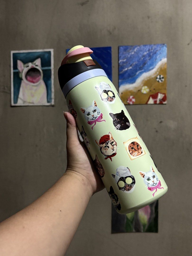 Cute Cat Pattern Insulated Water Bottle Pastel Green (Category: Water Bottles & Tumblers) located in Manila. Submitted by royalpengwen (Listing ID 1470441308, Image 1). Description: - Design: Adorable cat illustrations on a light pastel green background - Finish: Smooth matte finish on a durable solid metal body - Cap: Multicolored cap featuring a convenient straw/flip-top mechanism - Use: Ideal for daily hydration at school, the office, or for c