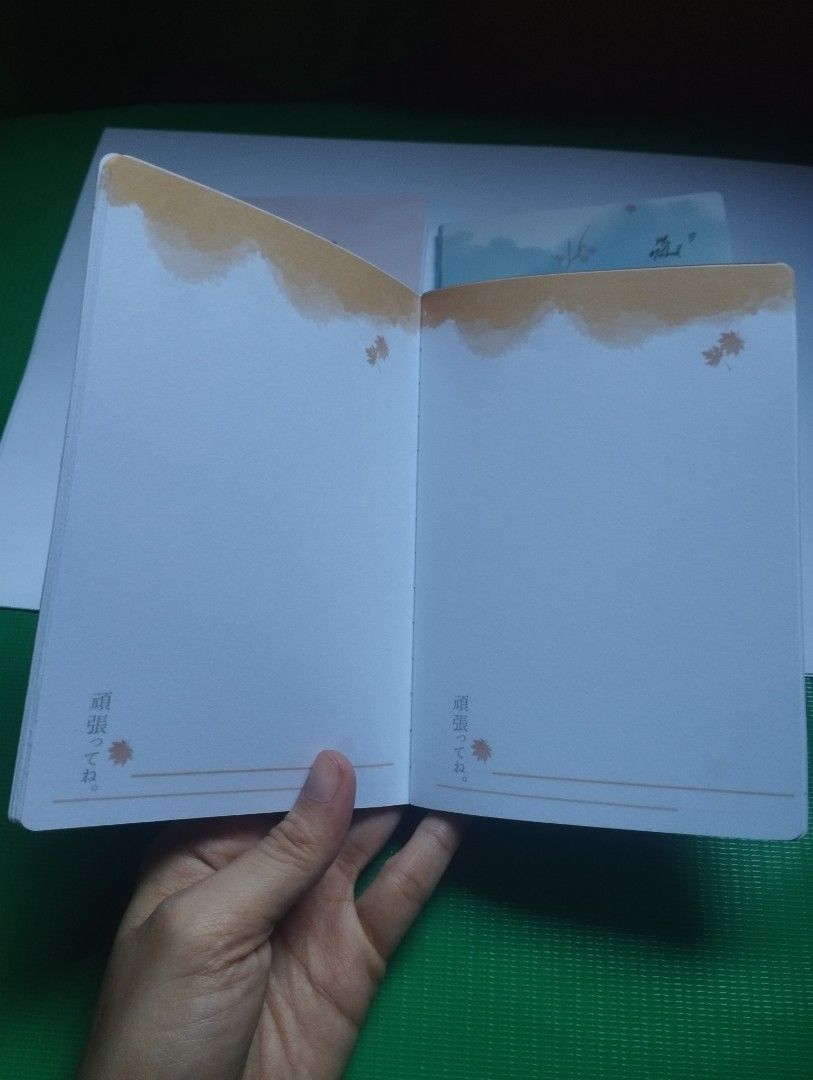 Cute Gradient Autumn Aesthetic Notebook Diary Journal (Category: Stationery & School Supplies) located in San Mateo. Submitted by diana_01.tree (Listing ID 1470351396, Image 3). Description: - Design: Gradient orange & yellow cover with aesthetic autumn girl art and Japanese text details - Inside Pages: Features lovely watercolor headers with cute maple leaf graphics - Condition: Brand new, clean pages, ready for writing - Best For: Journaling, d