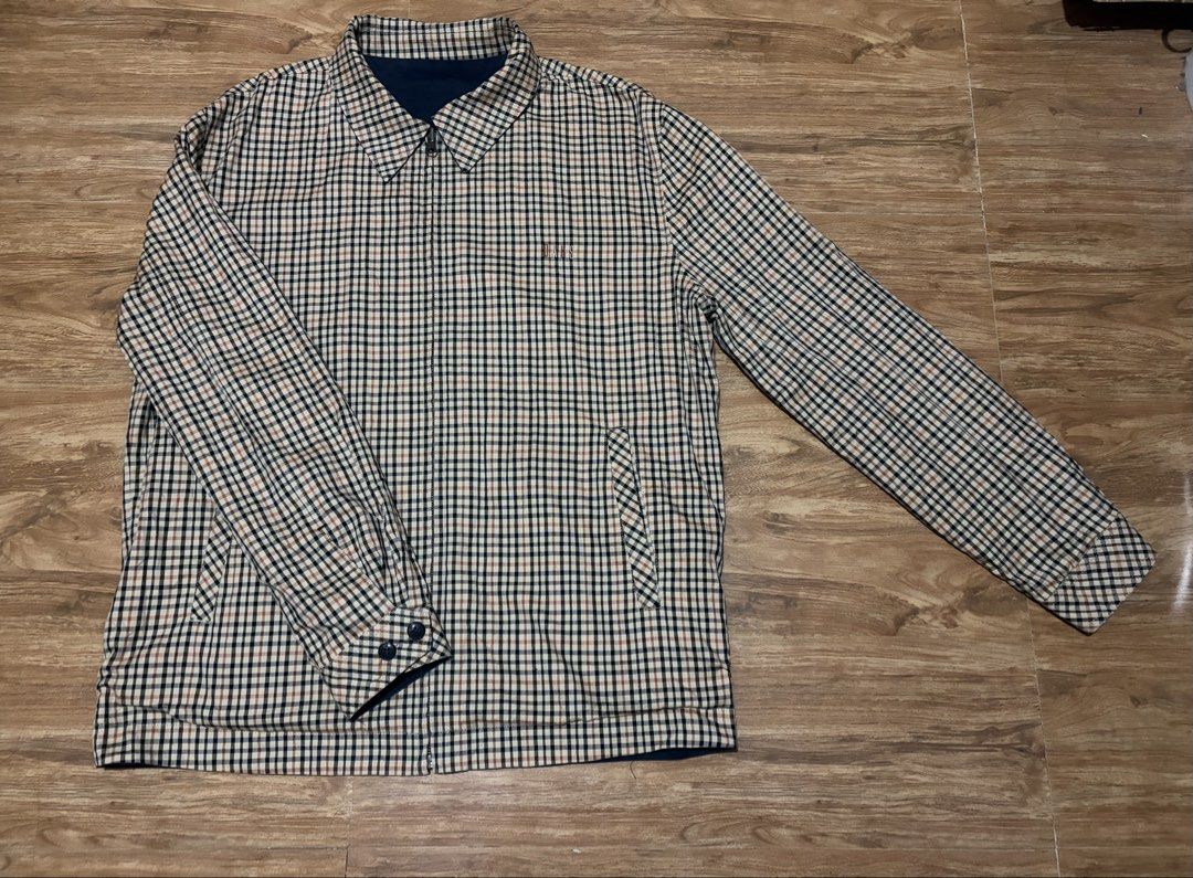 DAKS Reversible Plaid and Navy Jacket (Category: Coats, Jackets and Outerwear) located in Balanga. Submitted by momstyle.ph (Listing ID 1470440404, Image 2). Description: - DAKS reversible jacket - Side 1: Solid navy with branded tab and patterned pocket trim - Side 2: Classic beige check heritage pattern - Full front zipper closure - Pointed collar and button cuffs - 2-in-1 versatile style UNISEX SALE PRICE❤️.