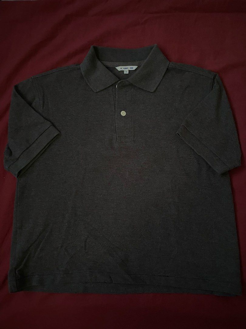 Dark Grey Polo Shirt croptop (Category: Tshirts & Polo Shirts ) located in Manila. Submitted by love_mami (Listing ID 1470450269, Image 1). Description: - Color: Dark grey - Design: Classic collar with light-colored front buttons and textured fabric - Sleeves: Short sleeves with clean cuffs - Versatility: Easy to match with jeans or shorts for a casual everyday look - Condition: Good as new.