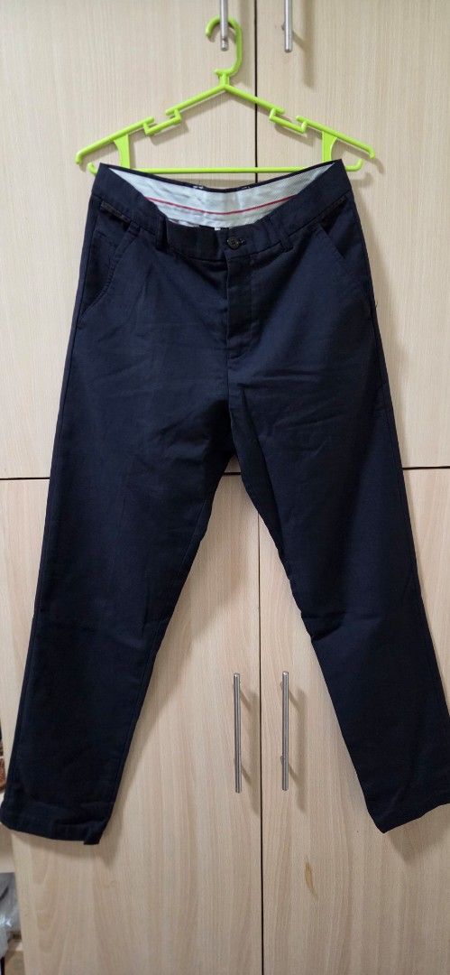 Dark Navy Blue Casual Pants Trousers (Category: Trousers) located in Manila. Submitted by doyak (Listing ID 1470422010, Image 1). Description: - Color: Dark navy blue - Fit: Regular fit, straight leg cut - Closure: Standard button closure and zip fly - Material: Smooth fabric with internal striped waistband lining - Style: Clean look, easy to match with shirts or tees - Versatility: Ideal for both office and weekend wear.