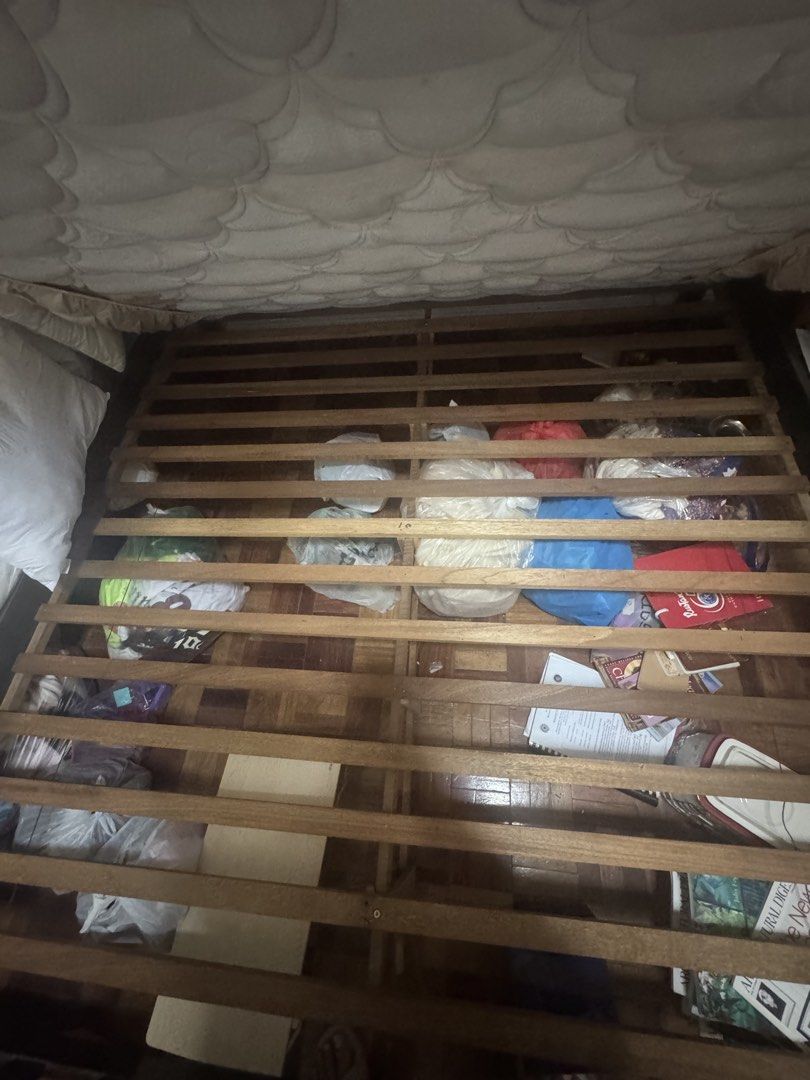 Dark Wood Bed Frame with Mattress (Category: Bed Frames & Mattresses) located in Paranaque City. Submitted by jiggybautista (Listing ID 1470392941, Image 3). Description: - Dark wooden bed frame with easy-lift slat base for spacious under-bed storage - Includes a comfortable quilted mattress with a fitted beige sheet - Sturdy structure with normal wear on the corners - Fits standard mattress sizes - Perfect upgrade for your bedroom - Pickup only 
