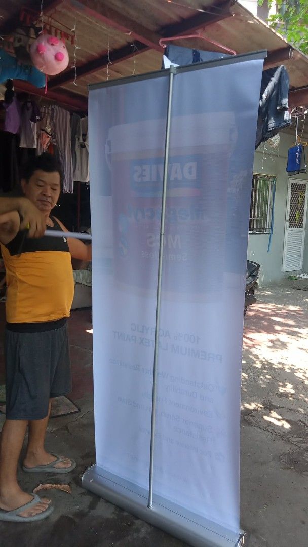 Davies Megacryl MCS Paint Roll-Up Banner Display (Category: Construction & Building Materials) located in Manila. Submitted by wisegem-231b (Listing ID 1470395704, Image 2). Description: - Davies Megacryl MCS semi-gloss paint promotional pull-up banner - High-quality, clean print showcasing 100% acrylic premium latex paint features - Highlights weather resistance and eco-friendly qualities - Includes sturdy aluminum base and stand - Retractable d