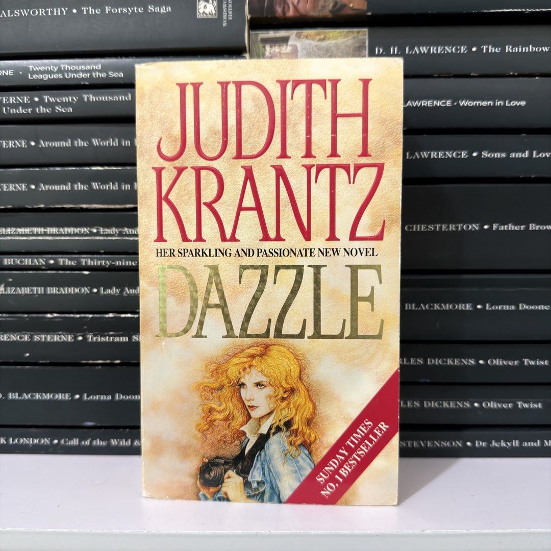 Dazzle by Judith Krantz Novel Paperback (Category: Storybooks) located in Lingayen. Submitted by readwjane (Listing ID 1470480021, Image 1). Description: - Title: Dazzle by Judith Krantz - Format: Paperback novel (Sunday Times No. 1 Bestseller) - Genre: Romance and drama - Condition: Readable copy with intact pages and minor shelf wear on edges - Features: Classic cover illustration.