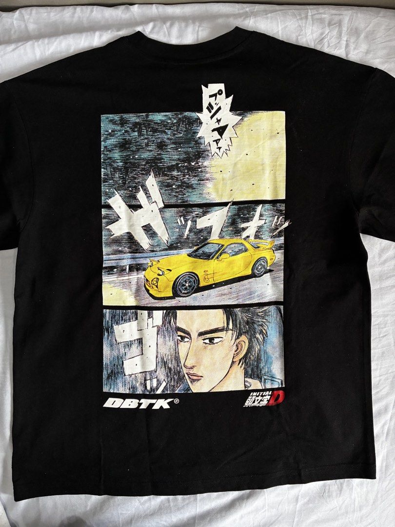 DBTK x Initial D Keisuke T-Shirt Size L (Category: Tshirts & Polo Shirts ) located in Manila. Submitted by nikkoour (Listing ID 1470407859, Image 3). Description: - Authentic DBTK x Initial D collaboration tee - Color: Black - Size: Large (tag at collar with branded neck tape) - Design: Small front manga print with yellow car and DBTK logo; large multi-panel back graphic featuring Keisuke's FD RX-7 and character portrait - Details: Woven collab p
