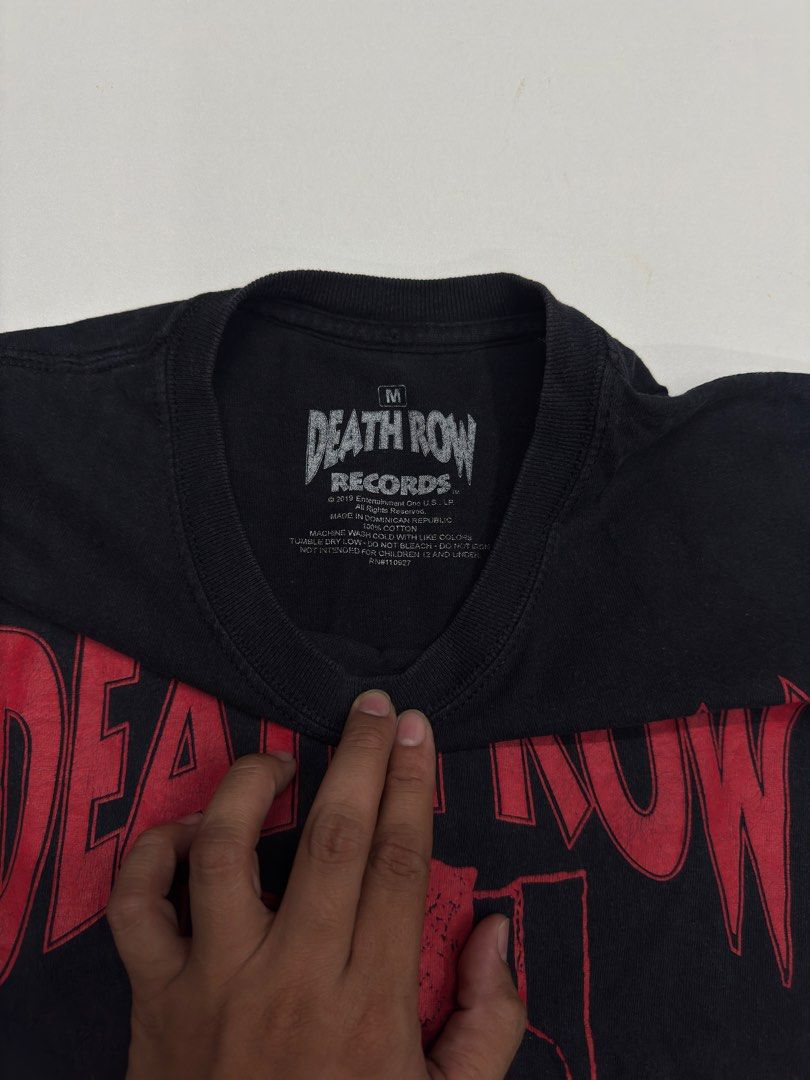 Death Row Records Black T-Shirt Medium (Category: Tshirts & Polo Shirts ) located in Bustos. Submitted by thenlnclot60500 (Listing ID 1470446867, Image 2). Description: - Official Death Row Records merchandise (2019) - Color: Black with bold red electric chair chest graphic - Size: Medium (tag printed inside the collar) - Material: 100% cotton, standard short sleeve crewneck cut - Origin: Made in Dominican Republic - Condition: Brand new/Mint.