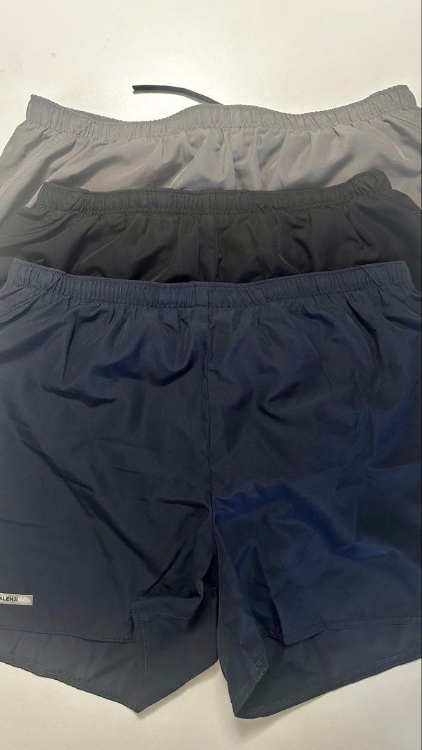 Decathlon Running Bottoms Pack (Category: Activewear) located in Makati City. Submitted by migsbaltasar (Listing ID 1470359941, Image 2). Description: - Bundle of sports shorts (Kalenji and Kiprun brands) - Colors: Grey, black, and navy blue - Includes one pair of black XL compression cycling shorts - All shorts feature comfortable elastic waistbands - Ideal for workouts, running, and gym sessions - Selling as a complete set.