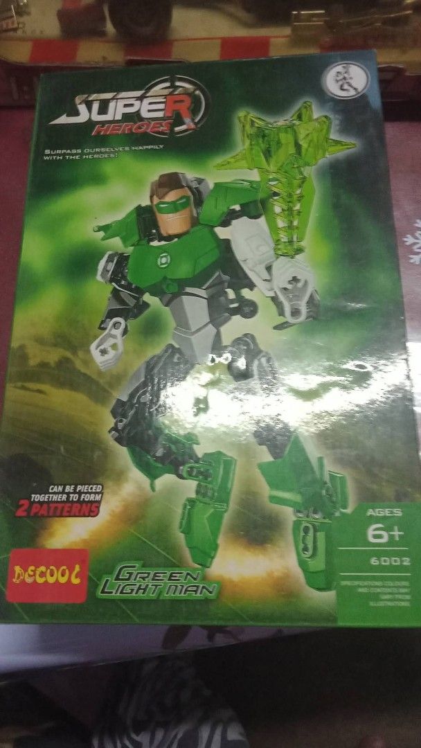 Decool Super Heroes Green Light Man Building Toy 6002 (Category: Lego & Building Sets) located in Manila. Submitted by wisegem-231b (Listing ID 1470396906, Image 1). Description: Decool Super Heroes building set, model 6002 Green Light Man. Includes character figure and accessories in box. Suitable for ages six and up. Part of a series where sets combine for bigger builds. Box shows some wear from storage. Fun build for superhero fans..