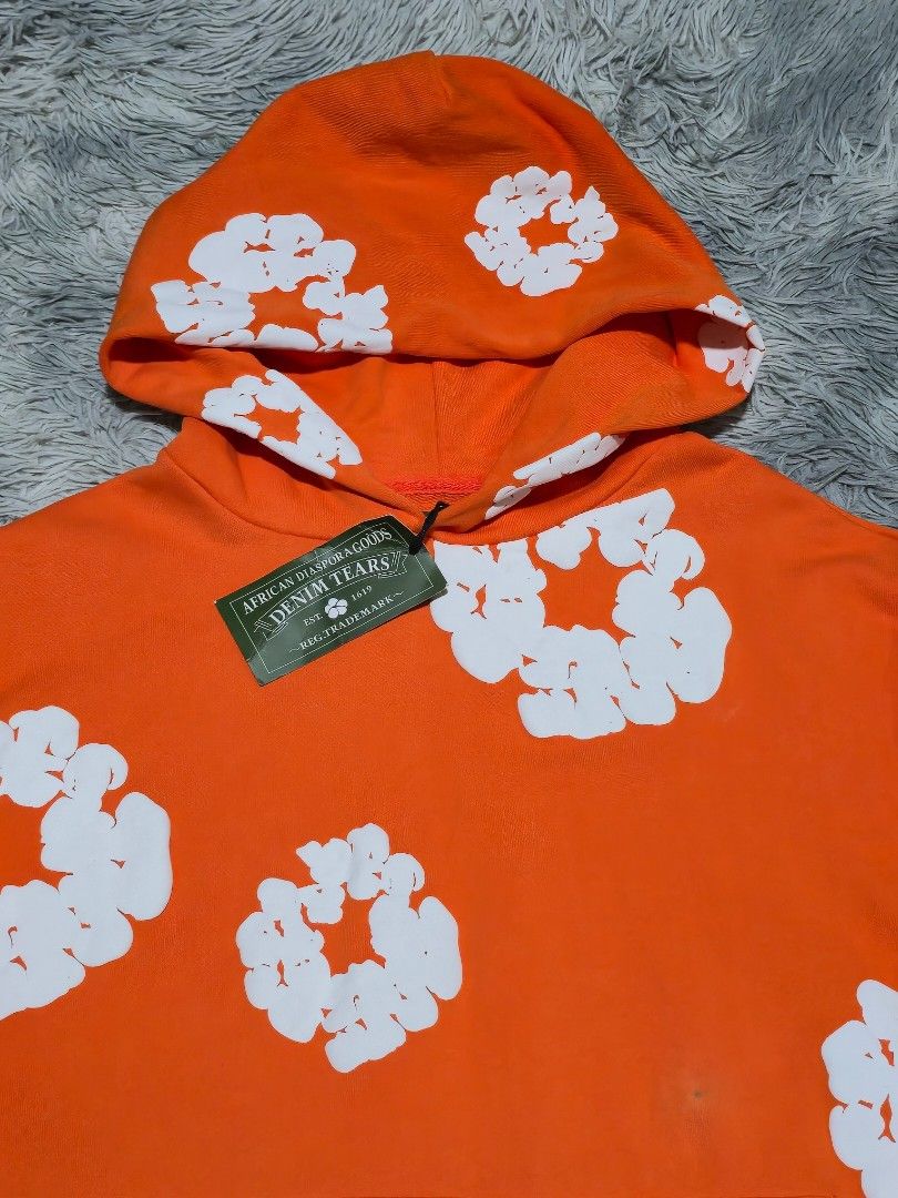 Denim Tears Orange Hoodie (Category: Hoodies) located in Abulug. Submitted by humanwhosellthings (Listing ID 1470482940, Image 3). Description: DENIM TEARS OVERSIZED HOODIE ✅️Size: Small on tag fit to Large ✅️Dimes: 24W x 26L ✅Condition: Like New ✅Issue: small dot stain ✅Color Rate: 10/10.