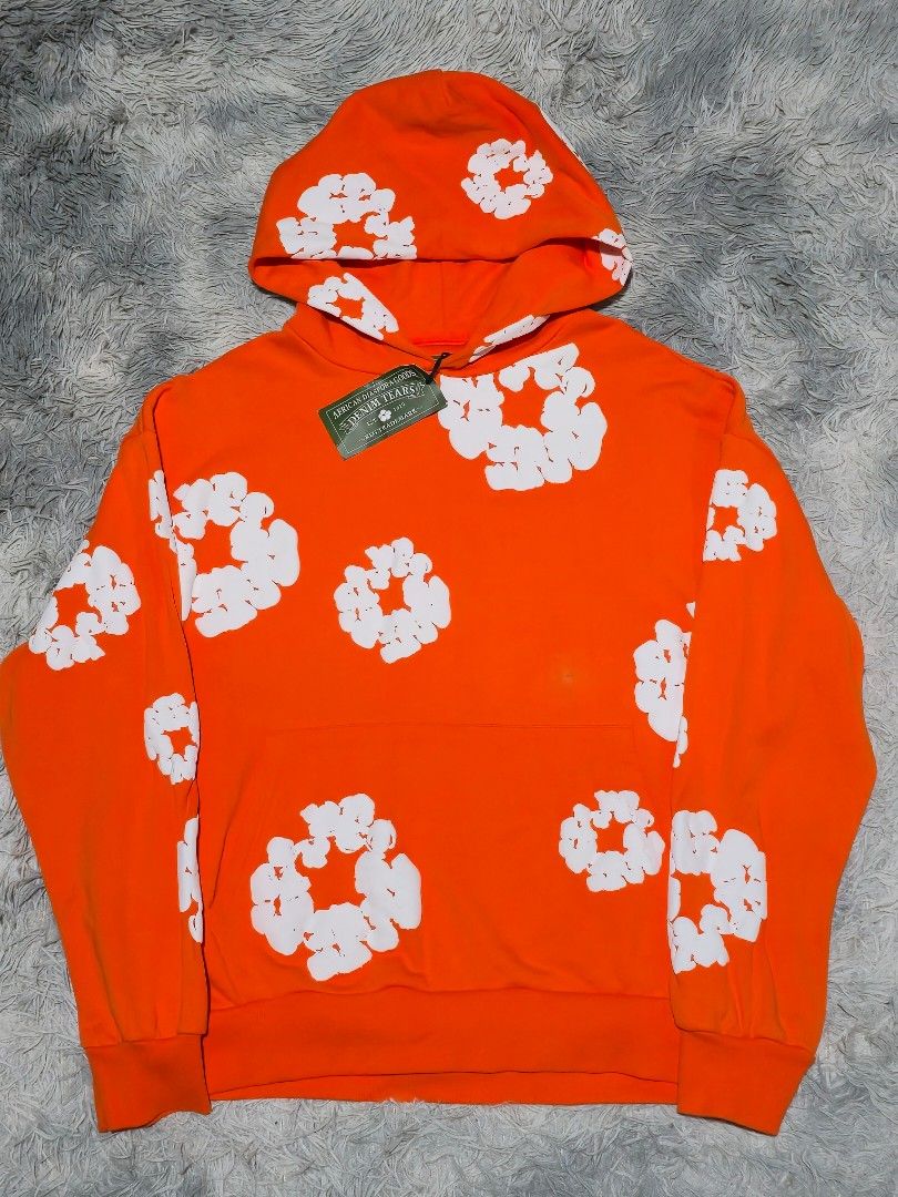 Denim Tears Orange Hoodie (Category: Hoodies) located in Abulug. Submitted by humanwhosellthings (Listing ID 1470482940, Image 1). Description: DENIM TEARS OVERSIZED HOODIE ✅️Size: Small on tag fit to Large ✅️Dimes: 24W x 26L ✅Condition: Like New ✅Issue: small dot stain ✅Color Rate: 10/10.