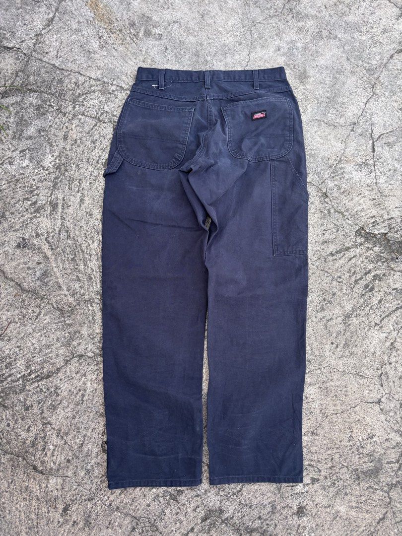 Dickies Black Cargo Pants Workwear Size 32x34 (Category: Trousers) located in Polomolok. Submitted by rrthrift (Listing ID 1470503722, Image 2). Description: - Brand: Genuine Dickies - Color: Dark Navy / Black - Size: 32x34 (Regular Straight Fit) - Material: Heavy-duty cotton duck fabric - Features: Classic utility pockets, hammer loop, button closure, and zip fly - Condition: Sturdy and durable construction.