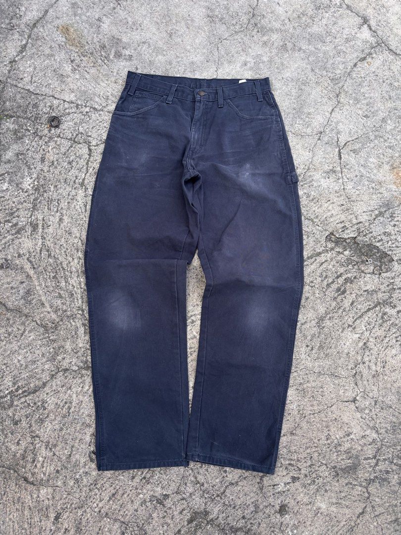 Dickies Black Cargo Pants Workwear Size 32x34 (Category: Trousers) located in Polomolok. Submitted by rrthrift (Listing ID 1470503722, Image 1). Description: - Brand: Genuine Dickies - Color: Dark Navy / Black - Size: 32x34 (Regular Straight Fit) - Material: Heavy-duty cotton duck fabric - Features: Classic utility pockets, hammer loop, button closure, and zip fly - Condition: Sturdy and durable construction.