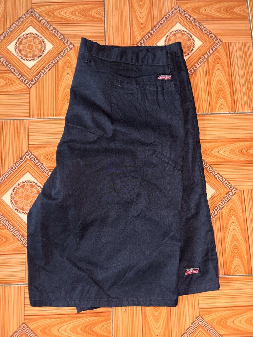 Dickies Black Work Shorts (Category: Shorts) located in Polomolok. Submitted by rrthrift (Listing ID 1470503013, Image 1). Description: - Brand: Dickies - Color: Black - Size: 42 length 24 - Material: 65% polyester, 35% cotton - Features: Signature logo patch on back pocket and lower hem, classic workwear style, wide belt loops - Origin: Made in Honduras.
