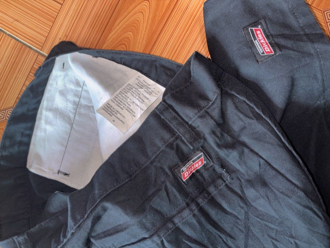 Dickies Black Work Shorts (Category: Shorts) located in Polomolok. Submitted by rrthrift (Listing ID 1470503013, Image 2). Description: - Brand: Dickies - Color: Black - Size: 42 length 24 - Material: 65% polyester, 35% cotton - Features: Signature logo patch on back pocket and lower hem, classic workwear style, wide belt loops - Origin: Made in Honduras.