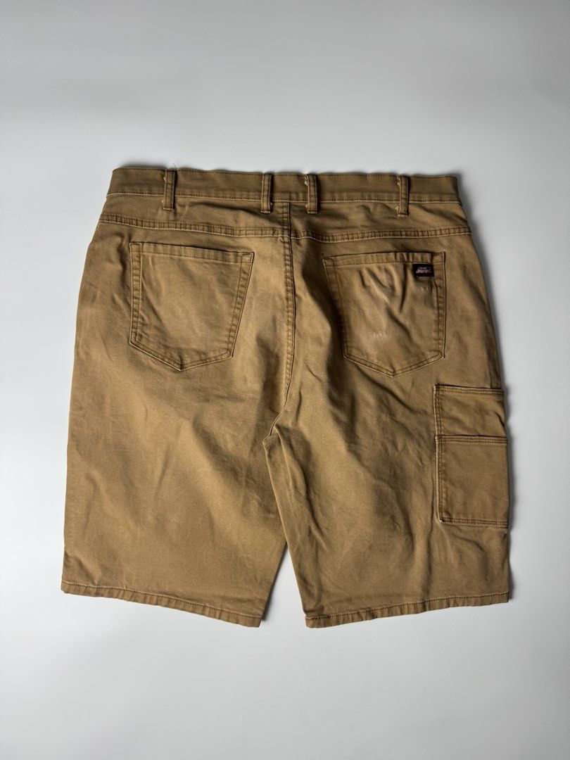 Dickies Brown Cargo Work Shorts (Category: Shorts) located in Cavite. Submitted by dracokidstuff (Listing ID 1470373105, Image 1). Description: - Brand: Dickies - Style: Classic carpenter work shorts with side utility pockets - Material: Durable brown canvas - Features: Button closure and belt loops - Condition: Pre-loved with some wear and dark marks near the bottom hems from actual work use.