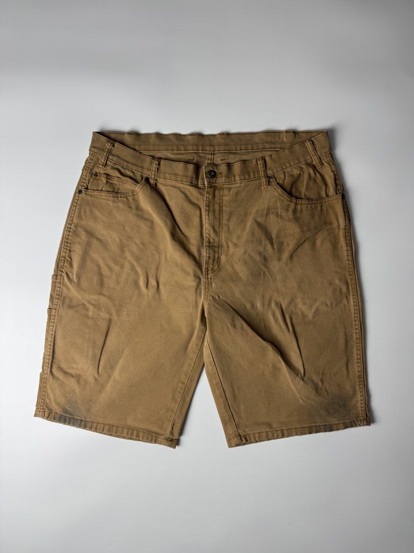 Dickies Brown Cargo Work Shorts (Category: Shorts) located in Cavite. Submitted by dracokidstuff (Listing ID 1470373105, Image 2). Description: - Brand: Dickies - Style: Classic carpenter work shorts with side utility pockets - Material: Durable brown canvas - Features: Button closure and belt loops - Condition: Pre-loved with some wear and dark marks near the bottom hems from actual work use.